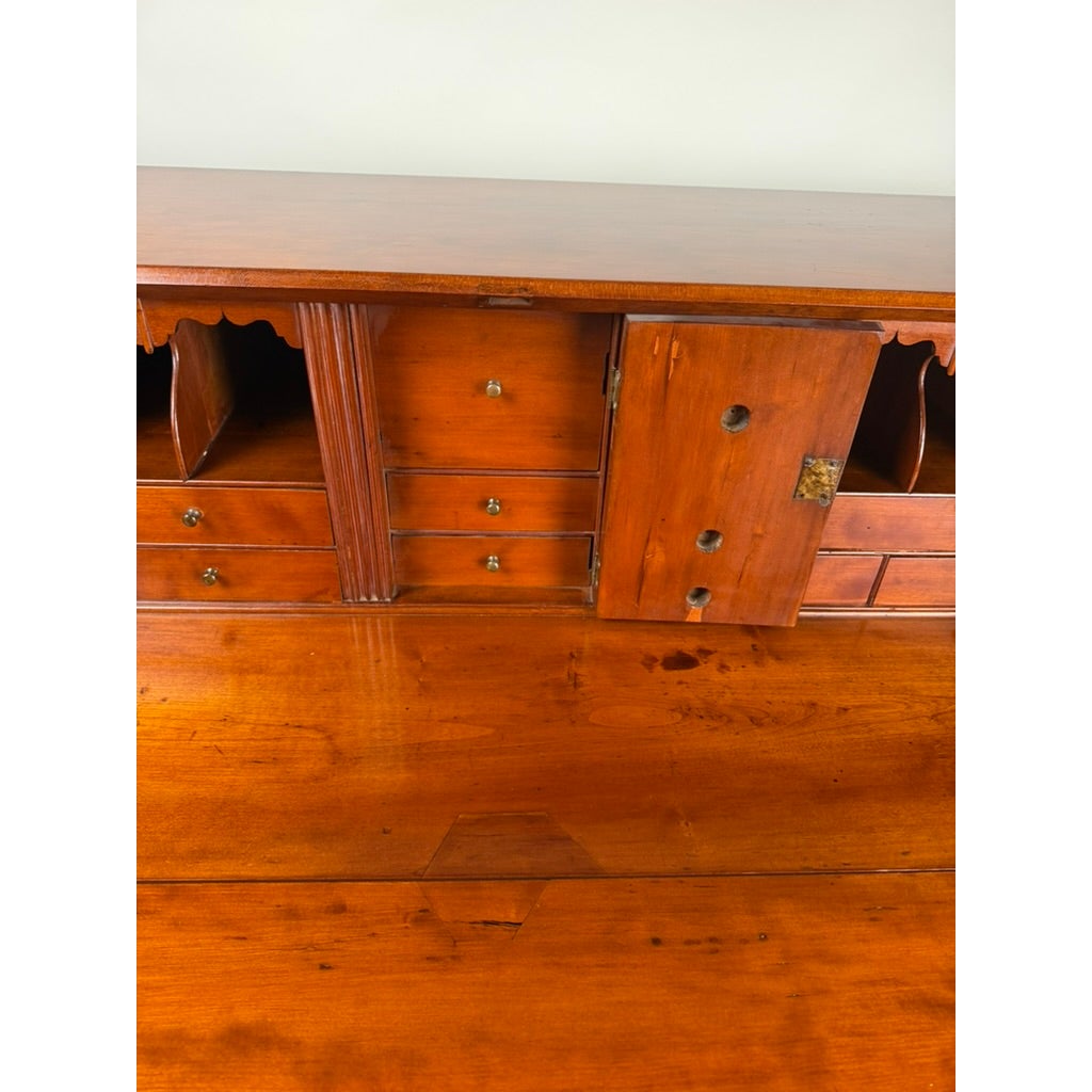 Open interior of a Chippendale Cherry Slant-Front Desk with Ogee Bracket Feet, Possibly Connecticut River Valley, circa 1770–1790, showing small drawers, cubbies, and a hinged central door.