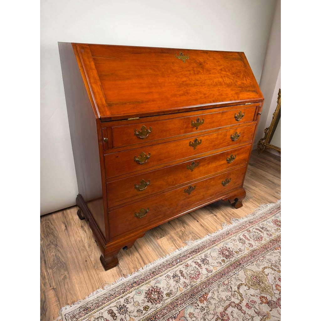 Chippendale Cherry Slant-Front Desk with Ogee Bracket Feet, Possibly Connecticut River Valley, circa 1770–1790, a cherry wood slant-front desk with four drawers, brass pulls, and ogee bracket feet.