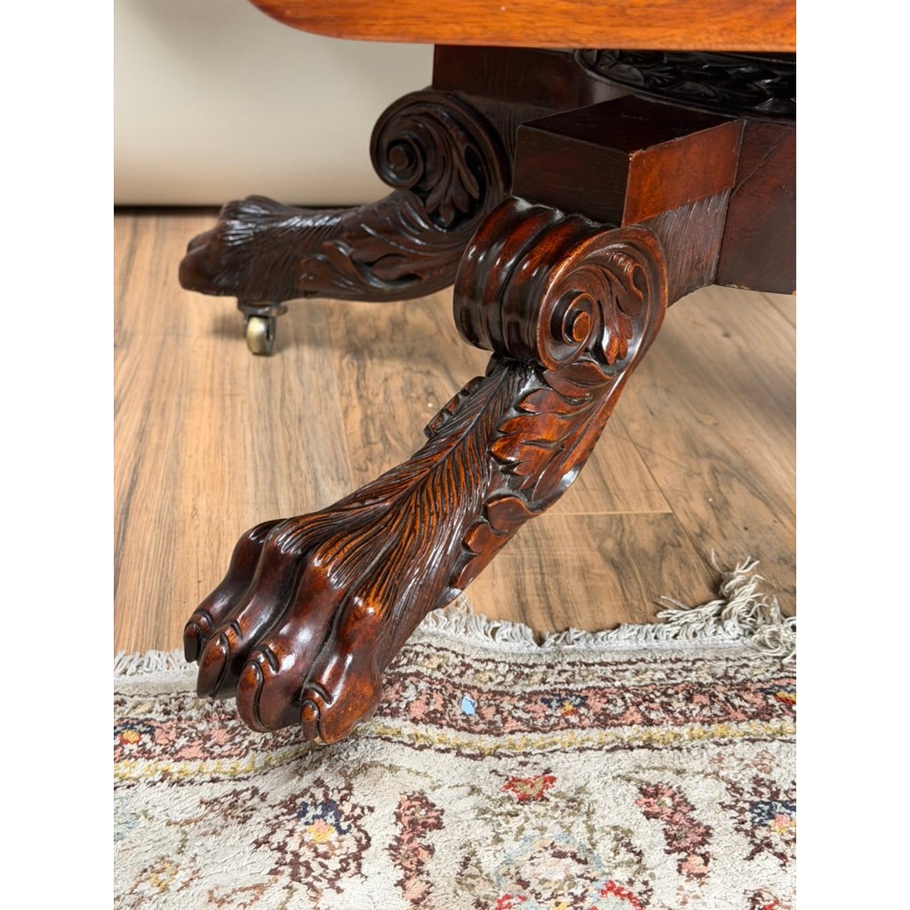 Close-up of a carved lion’s paw foot with scrolled detailing on the American Classical Carved Mahogany Drop-Leaf Breakfast Table, c. 1825–1840 Possibly New York or Philadelphia.