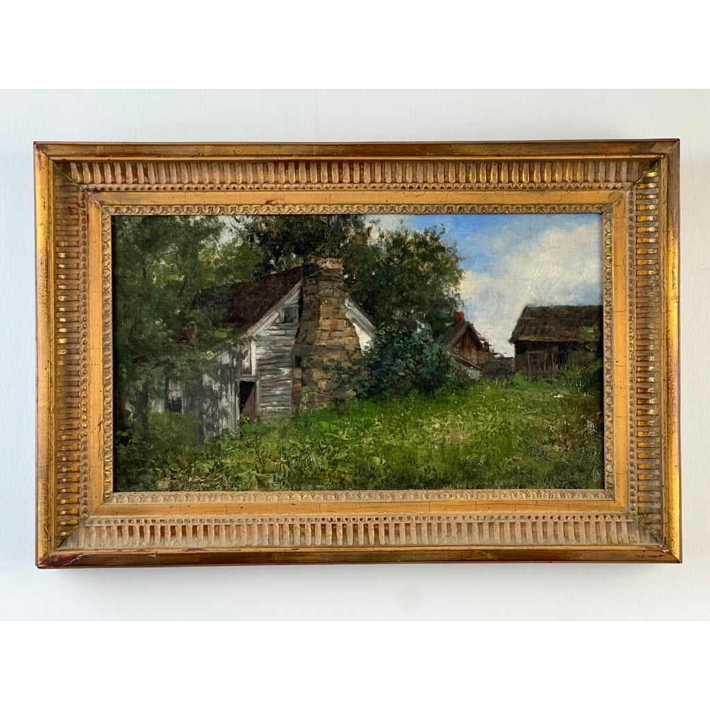 The Antique American School Farmstead Landscape Oil Painting, Circa 1900, depicts a weathered wooden house with a stone chimney and outbuildings amid lush greenery and trees under a blue sky in classic rural style.
