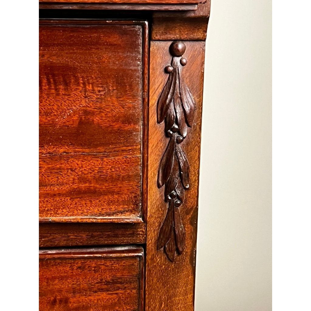 Close-up of an Antique Directoire Style French Cylinder Desk with Slate Top (Late 19th Century), showcasing ornate carved leaf and berry details in rich, reddish-brown wood against a plain light background. Brand: Unknown.