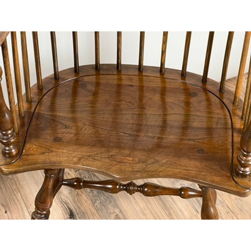 Close-up of Stickley Windsor chair seat with surface scratching from use
