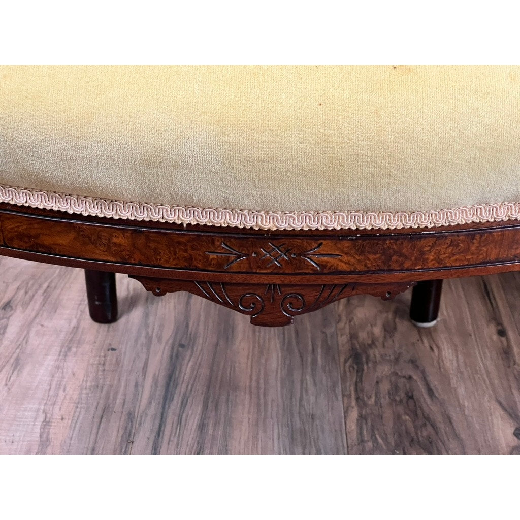 Close-up of a Fine Antique Pair Renaissance Revival Walnut Side Chairs, attributed to John Jelliff (Newark, c. 1880), with light yellow upholstery, decorative trim, carved wood details, and set on a wood-patterned floor.