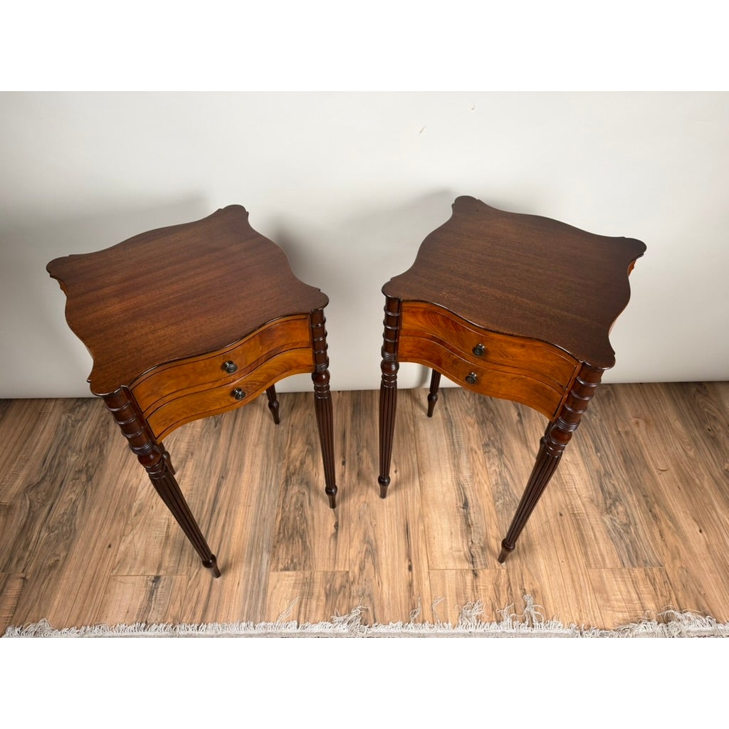 Pair of American Classical Revival Mahogany Two-Drawer Work Tables, circa 1880–1910, each featuring two drawers and four tapered, turned legs.