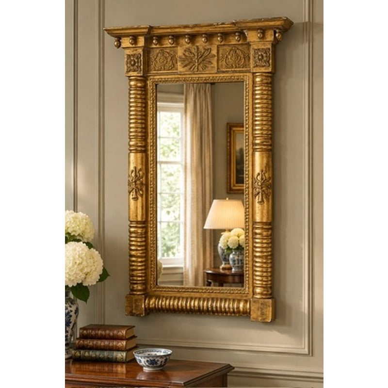 An American Federal Giltwood Pier Mirror, possibly Massachusetts or New York, circa 1815–1830, featuring carved columns, floral details, and a molded cornice.