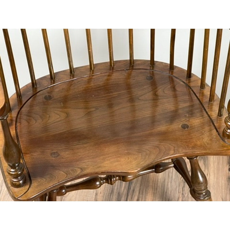 Close-up of Stickley Windsor chair seat with surface scratching from use
