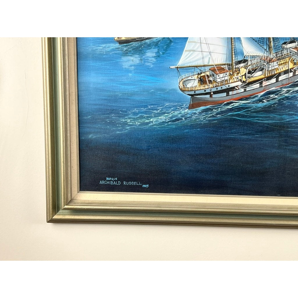 Close-up of "Barque Archibald Russell 1905," an oil on canvas by John Richard Perry ME, 1984, showing a sailing ship on blue water and the artist’s signature in the lower right. Brand: unknown.
