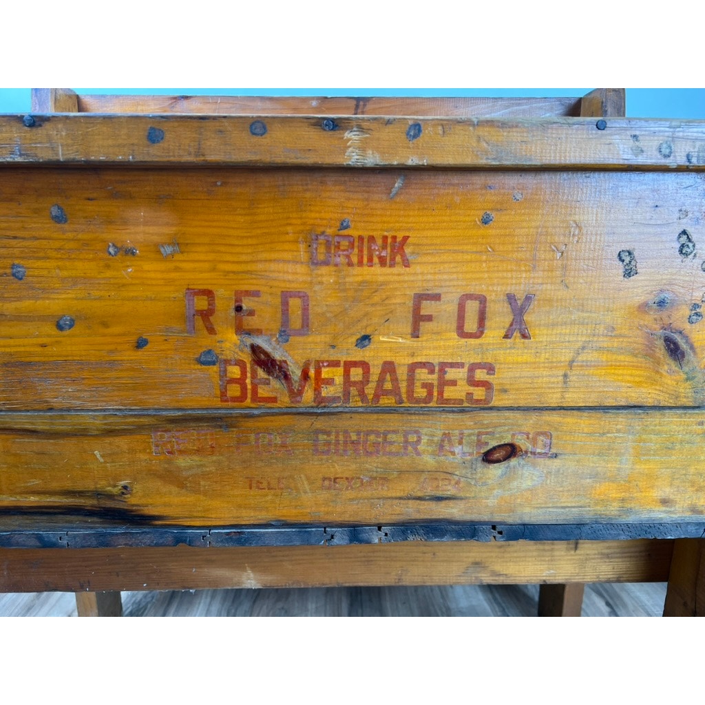 An Antique Tin Lined Pine Red Fox Ginger Ale Cooler (Rhode Island, c. 1930) with original faded branding—weathered and ideal for display with antique soda coolers. Brand: Red Fox.