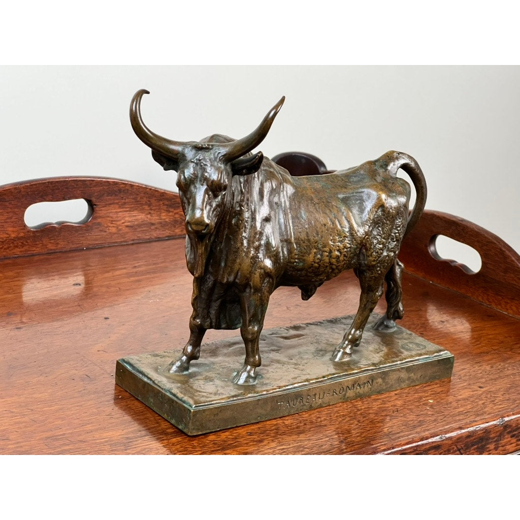 The Jean-Baptiste Clesinger “Taureau Romain” bronze bull sculpture (Barbedienne Foundry, Rome 1858) stands on a rectangular base inscribed with TAURUS - ROMAN and is displayed on a wooden tray.