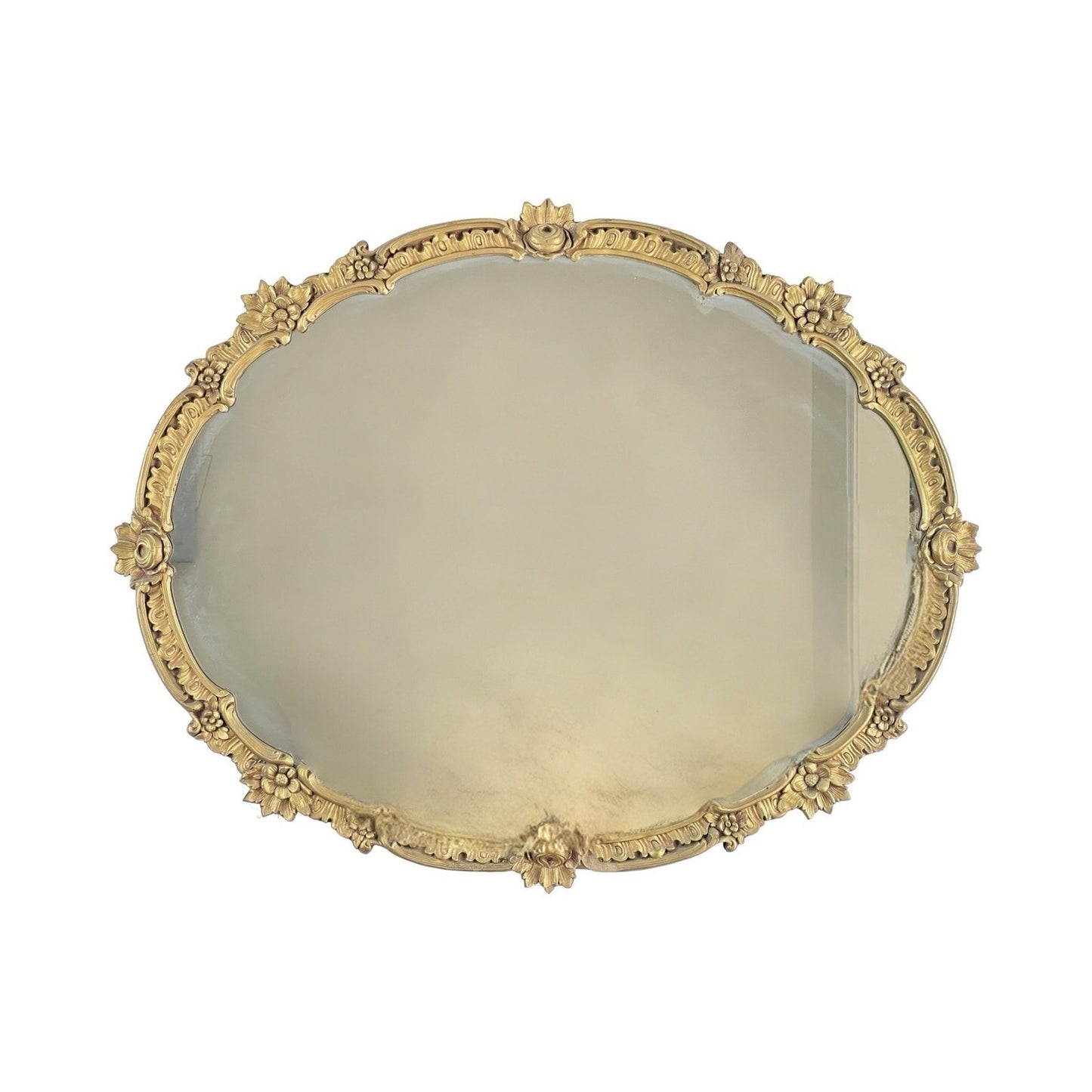 The Antique Gilt Wood Oval Mirror c. Early 20th Century features a gold decorative frame with floral and leaf motifs, making it an elegant classical revival accent for sophisticated interiors.