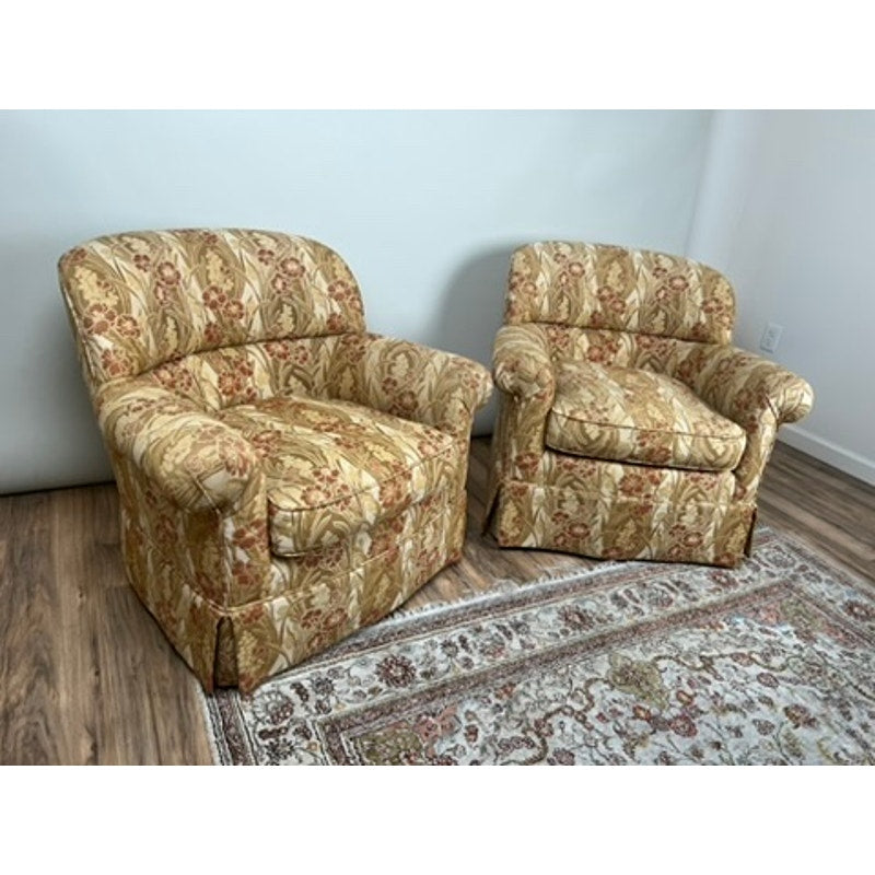 Pair of vintage upholstered club chairs, one swivel and one fixed