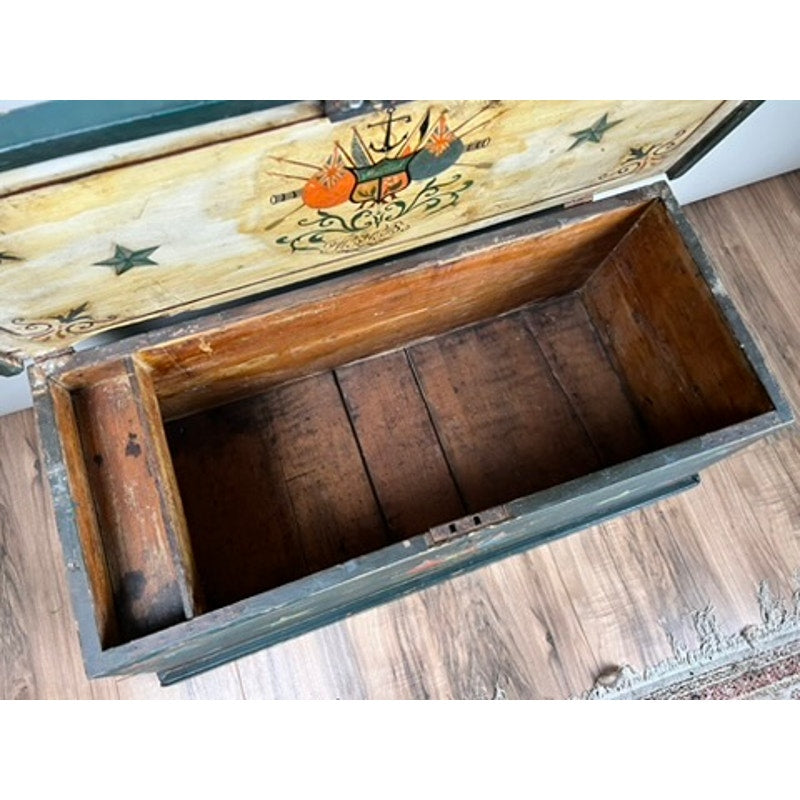 Antique Paint Decorated English Sea Chest c. Late 19th Century, featuring a painted lid, empty interior, and side compartment, displayed on a wooden floor near a rug. Brand: None/Unknown.