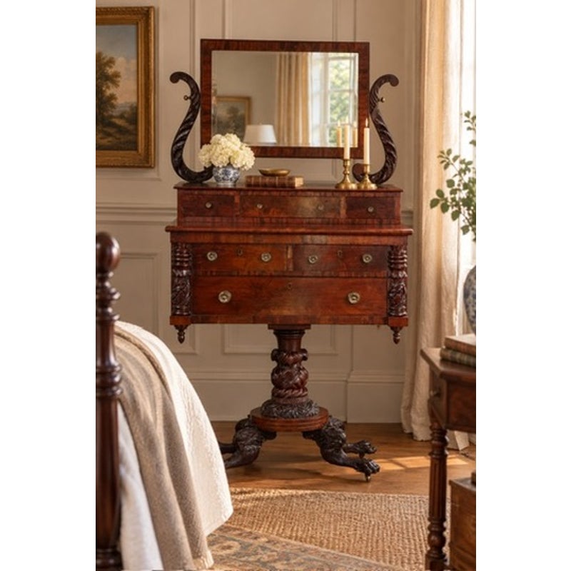 American Classical Carved Mahogany Dressing Table with Original Mirror, Probably New York, c. 1825–1835, featuring a central pedestal base, carved animal-paw feet, and an adjustable rectangular mirror supported by scrolled uprights.
