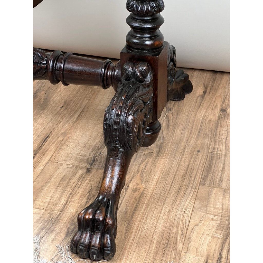 Close-up of an intricately carved dark wood leg from an impressive Antique American Empire Cheval Mirror (c. 1840), featuring acanthus and Barbola rose details, resting on a light wood floor—demonstrating exquisite craftsmanship.