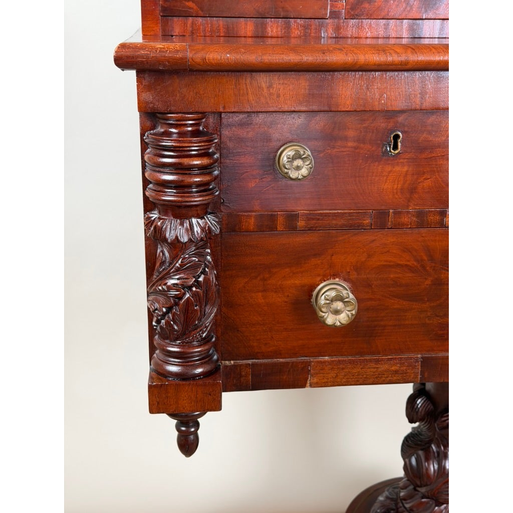 Detail of an American Classical Carved Mahogany Dressing Table with Original Mirror, Probably New York, c. 1825–1835, featuring a drawer with a brass flower-shaped knob and a column carved with acanthus leaves.