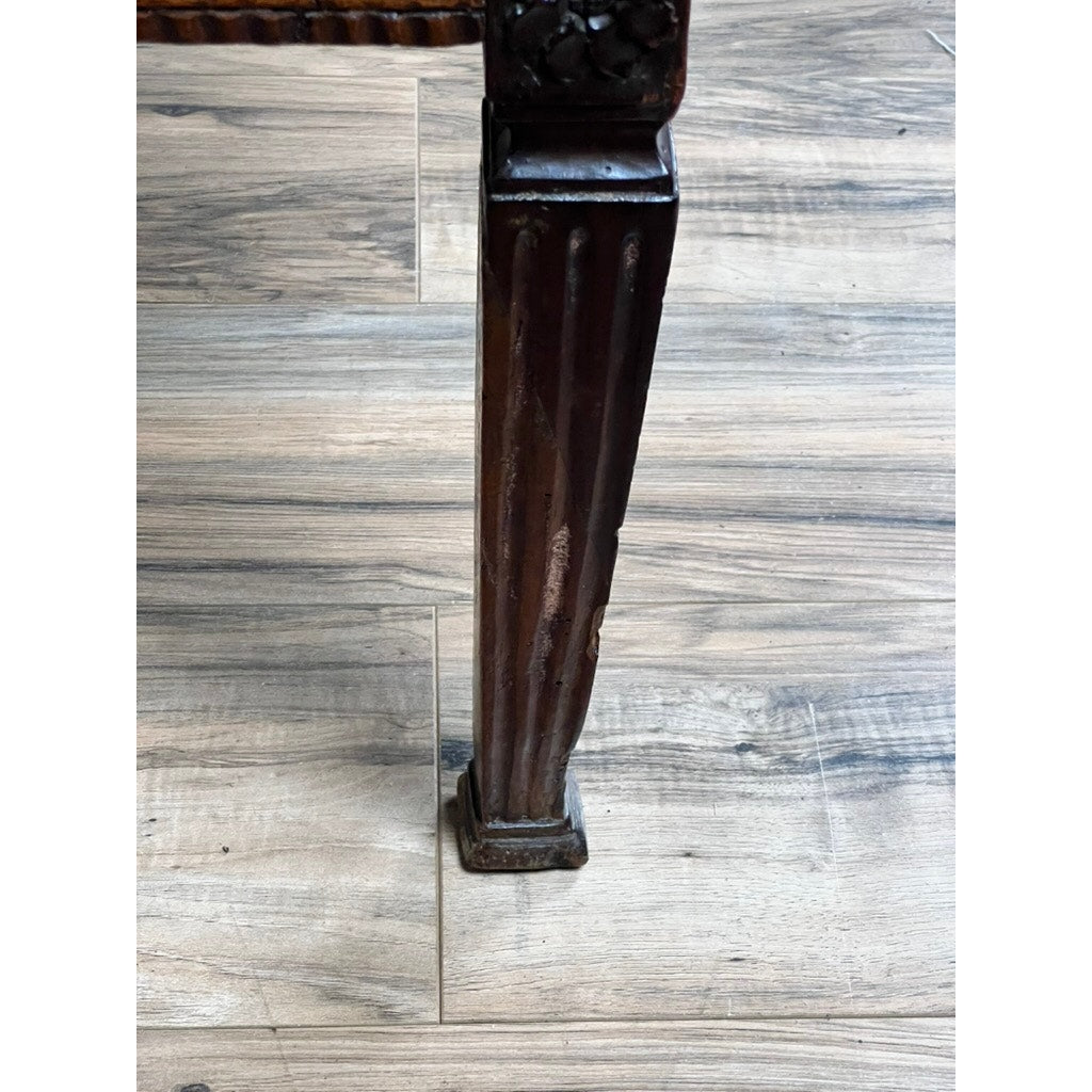 A close-up of a grooved dark wood table leg with carved details and a square base from an Antique Louis XVI Period Ladies Desk with Tooled Leather Top, c. 18th Century, standing on a light wood floor in neoclassical style.