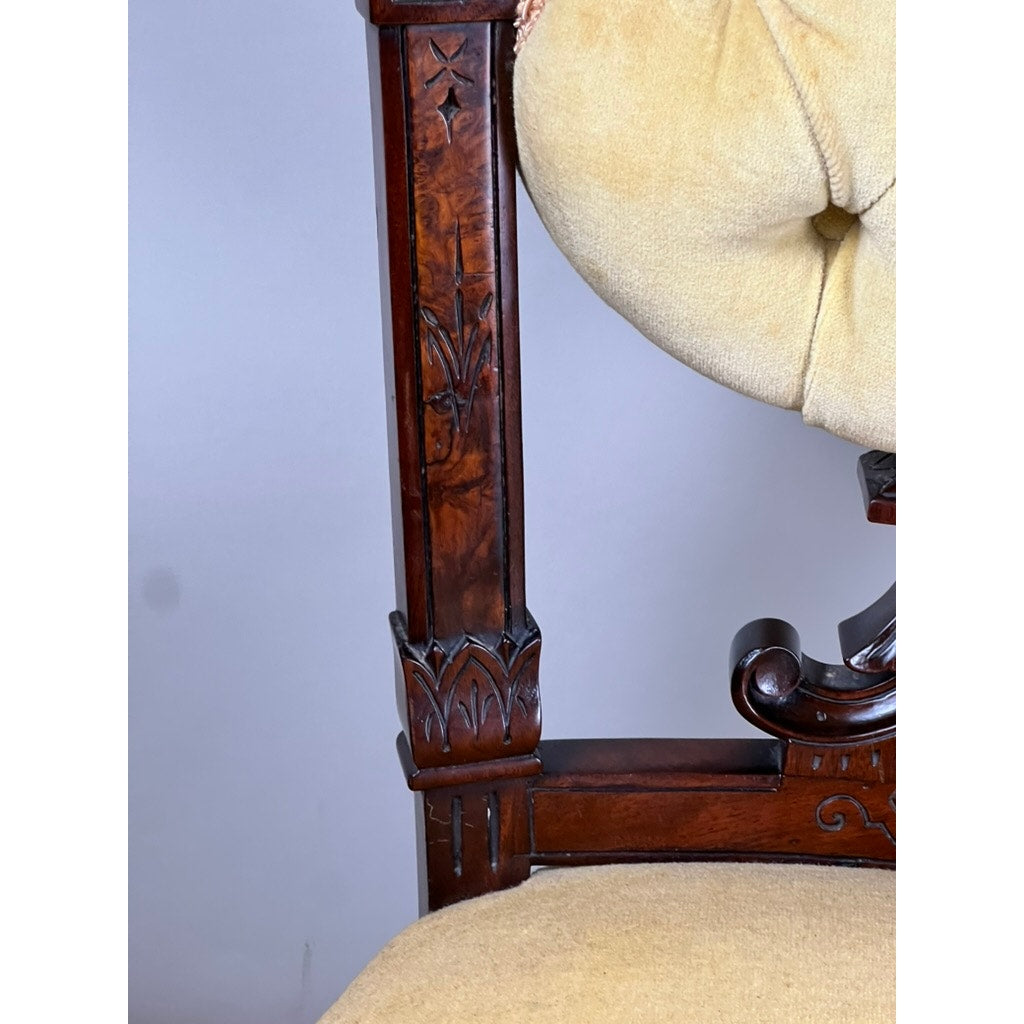 Close-up of a Fine Antique Pair Renaissance Revival Walnut Side Chairs, attributed to John Jelliff (Newark, c. 1880), showing ornate carving and light beige upholstery against a plain light gray background.