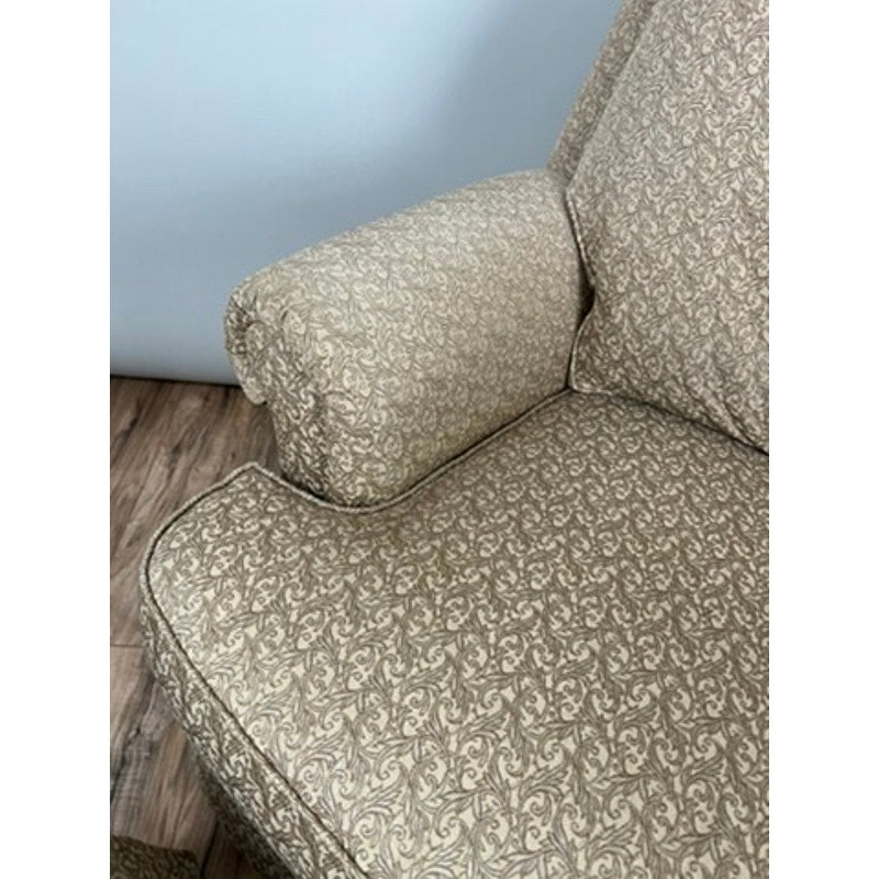 Jessica Charles rocking chair and ottoman in patterned neutral fabric