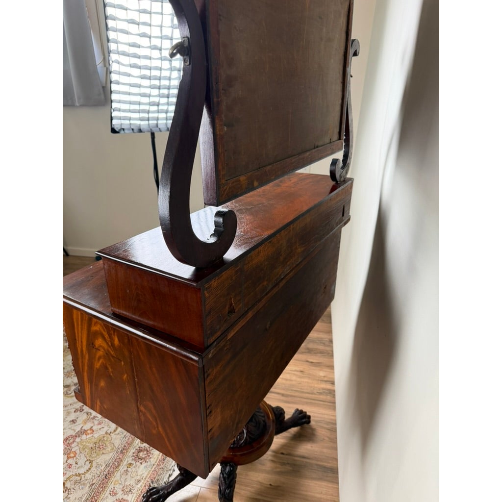 American Classical Carved Mahogany Dressing Table with Original Mirror, Probably New York, c. 1825–1835, featuring an upright rectangular mirror supported by curved side brackets.