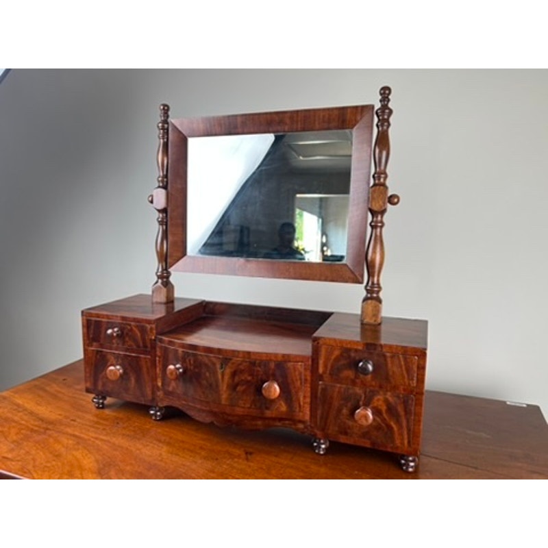 Early 19th century drop center shaving mirror with drawers and turned supports