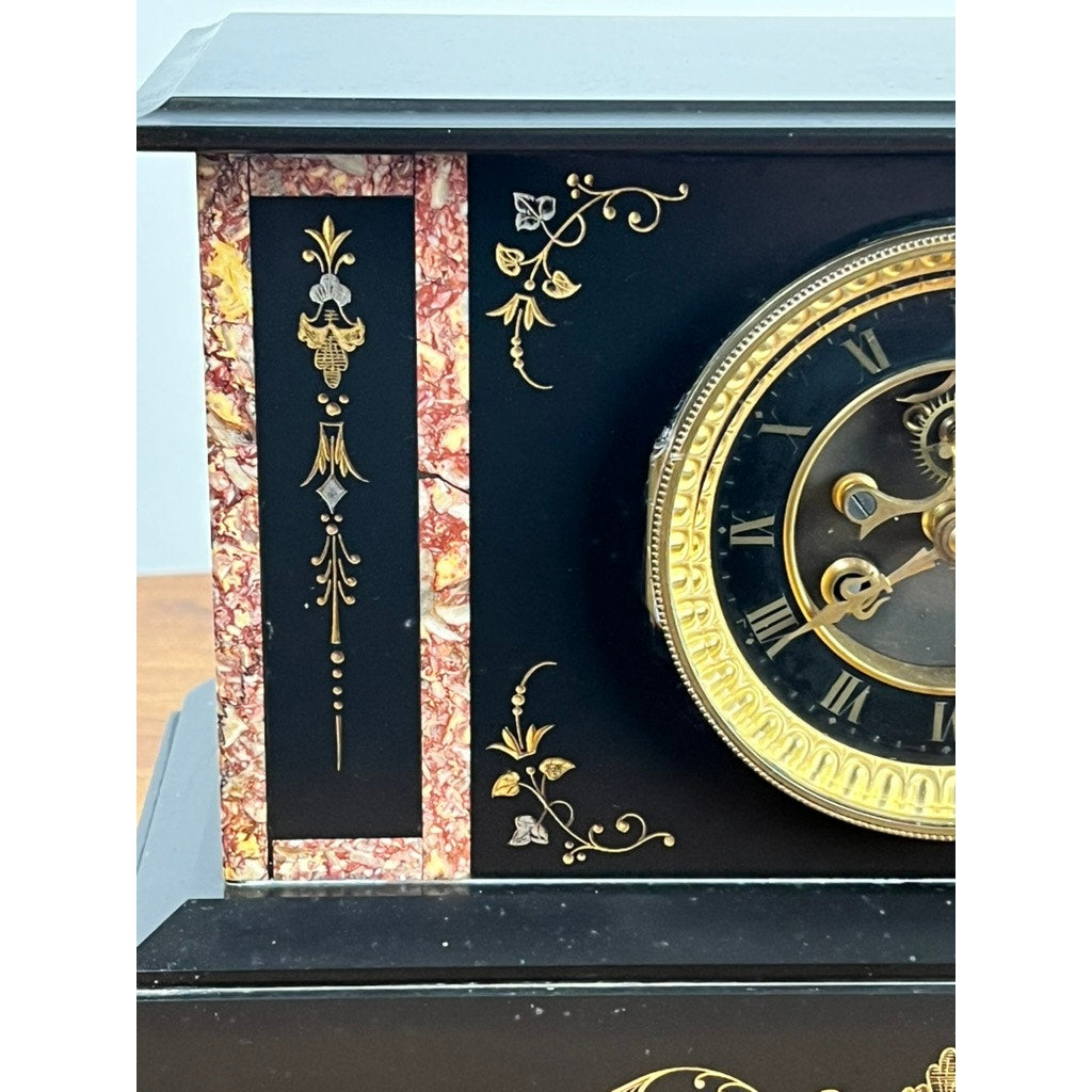 Close-up of an Antique Victorian Slate Mantle Clock with Open Escapement, c. Late 19th Century. Features black slate, ornate gold details, Roman numerals, and a left-side vertical red and gold marbled strip. Brand unknown.