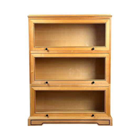 The Vintage Bench Made Maple with Wenge Inlay Three Stack Barrister Bookcase features three glass-front sections with black handles in a rectangular, modular design and a natural wood finish. Brand is unknown.