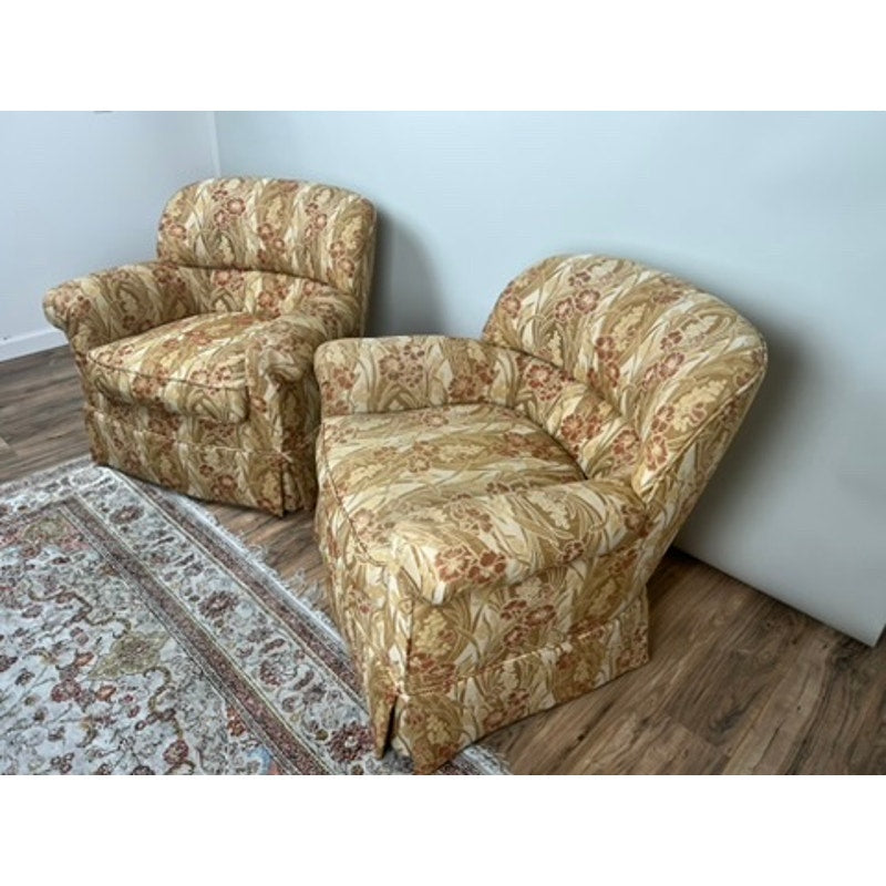 Pair of vintage upholstered club chairs, one swivel and one fixed