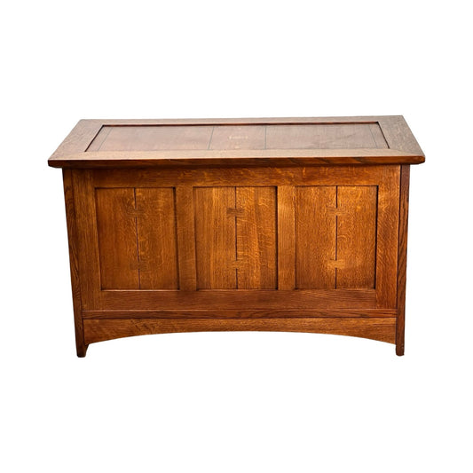 The Vintage Stickley Harvey Ellis Millennium Edition Oak Blanket Chest by Stickley features a paneled front, rectangular lid, visible wood grain, and Mission-style Arts & Crafts design, shown against a white background.