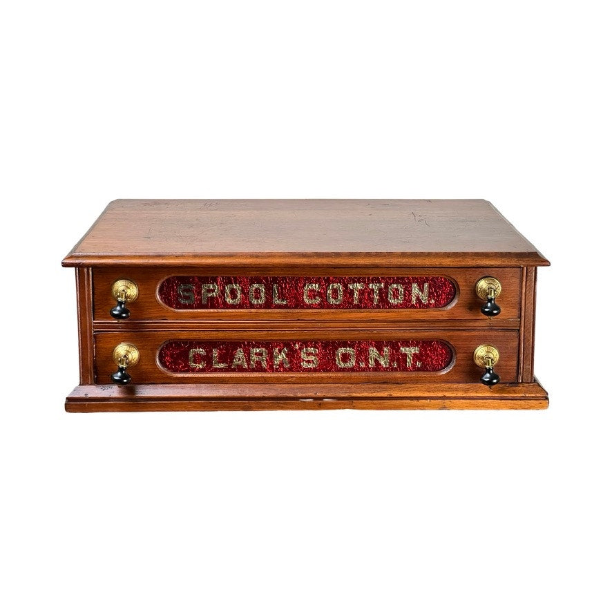 Antique Victorian pine two-drawer Clark’s ONT spool cabinet, late 19th century, with ornate red labels and brass pulls—a classic vintage thread cabinet for decor.