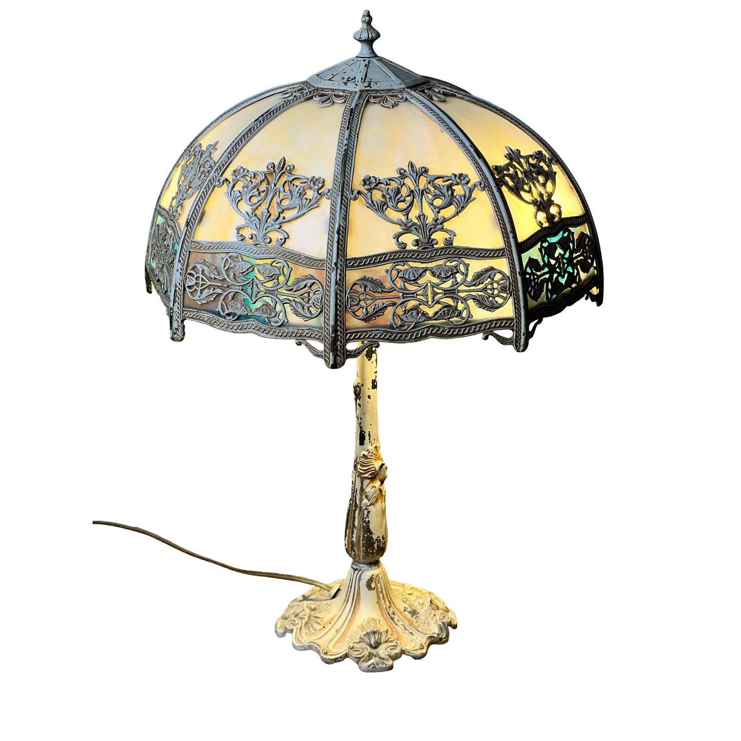 The Vintage Art Nouveau Slag Glass Two-Light Table Lamp (c. 1935–1955) features a dome-shaped ornate shade with floral designs, decorative base, and exposed power cord, providing elegant lighting when illuminated. Brand: Unknown.
