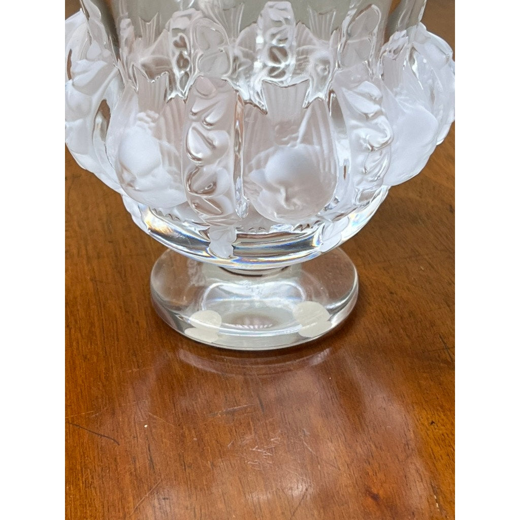 Close-up of the base and lower part of the vintage Lalique Dampierre Sparrow Footed Vase by Lalique, highlighting its intricate frosted and clear patterns as it rests elegantly on a polished wooden surface.