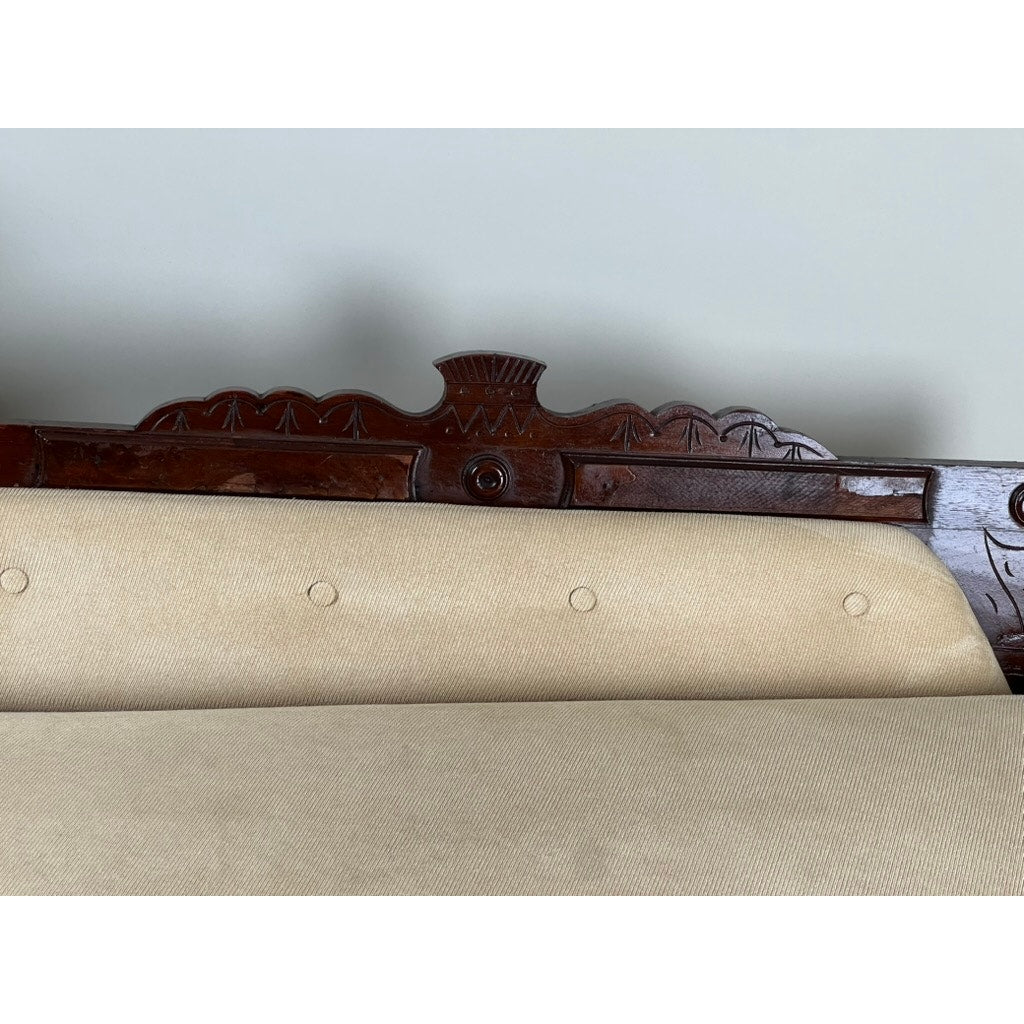 Antique walnut fainting couch with tufted beige upholstery Eastlake style