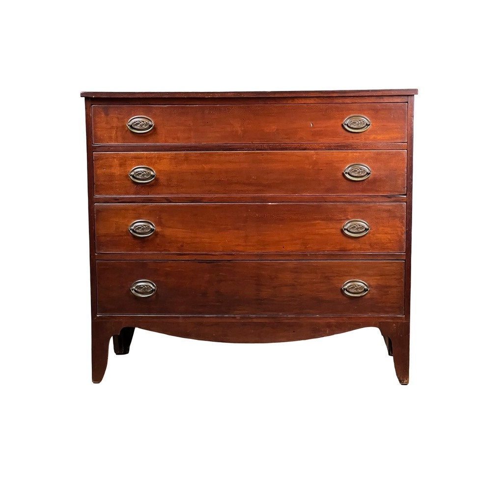 A rare labeled William Lloyd Springfield, Massachusetts Federal cherry chest of drawers, circa 1800, features four drawers with two oval brass handles each and is set against a white background.