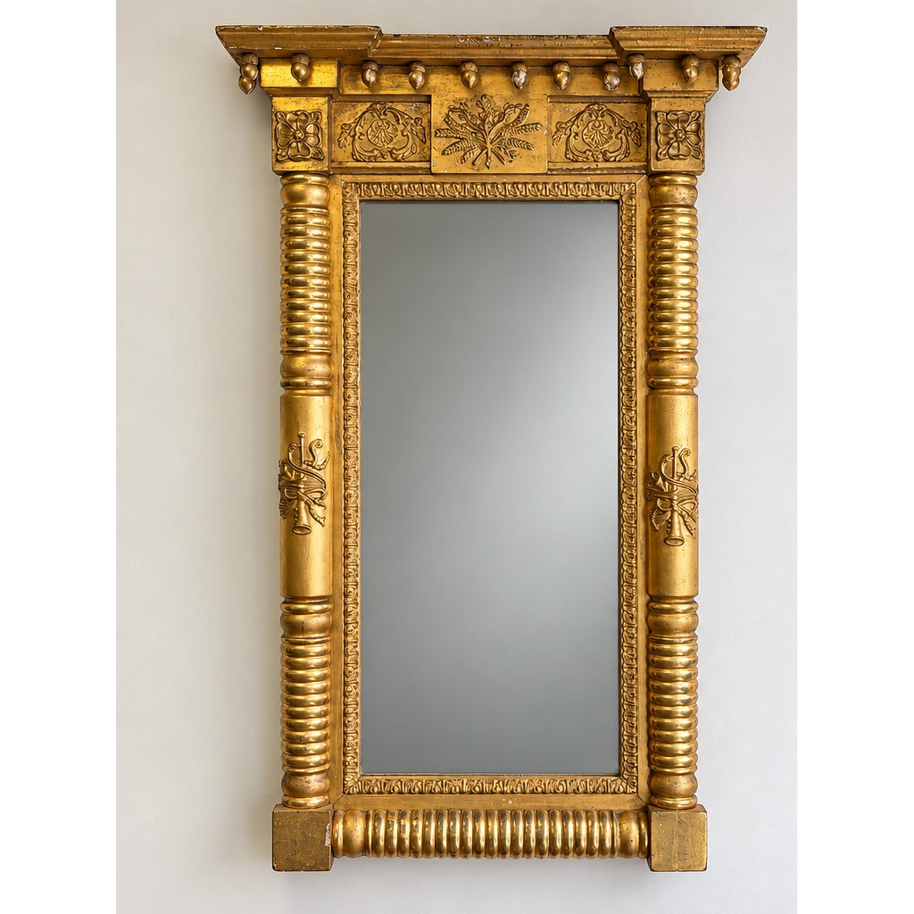 American Federal Giltwood Pier Mirror, possibly Massachusetts or New York, circa 1815–1830, a rectangular antique giltwood pier mirror featuring columns, ornate carvings, and a flared cornice.