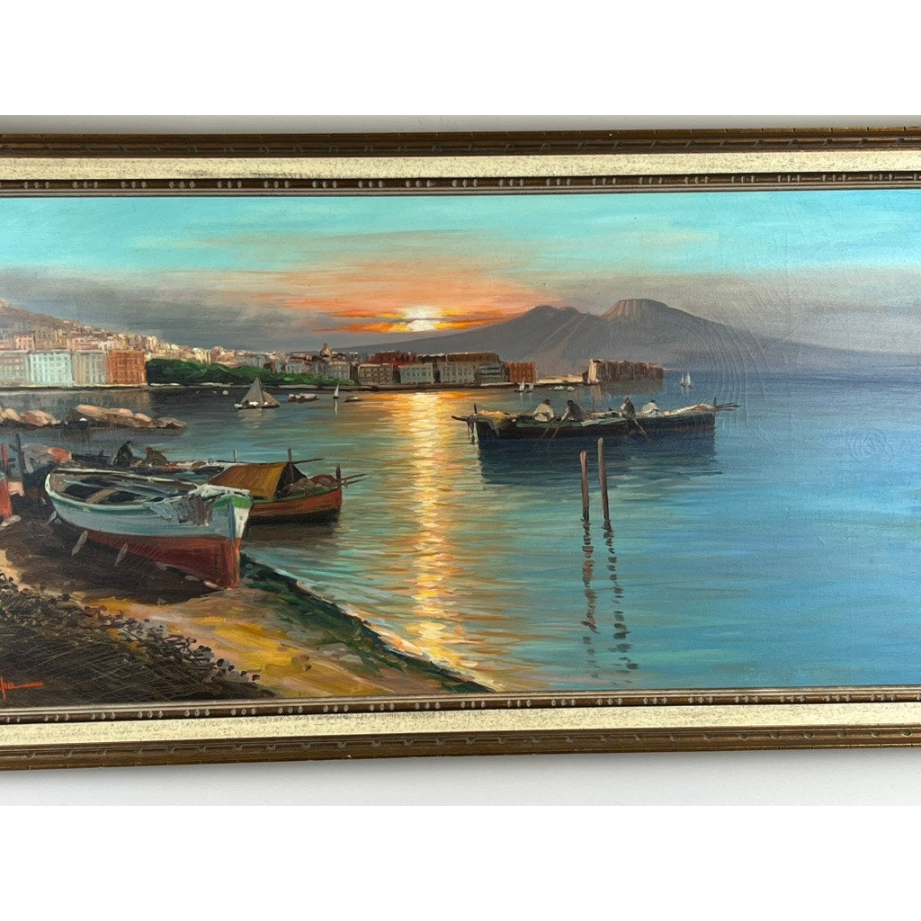 Painting Oil on Canvas “Naples Harbor” (28 x 52, signed lower left C. Ciappa): A sunset cityscape with boats on calm water, shoreline buildings, mountain backdrop, sunlit sea, and a gold frame; brand unknown.