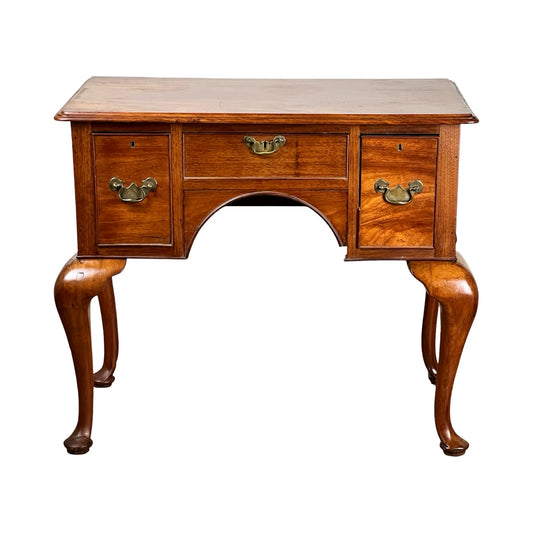Antique George III Queen Anne Mahogany Lowboy (late 18th c.) with three drawers, ornate brass handles, cabriole legs, and an arched cutout below the center drawer in classic Queen Anne style. Brand unknown.