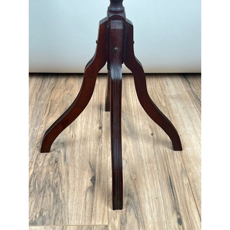 A close-up of an Antique Victorian Marble Top Plant Stand (late 19th century) with dark wooden tripod legs, set on a light wooden floor against a plain light background. Brand: Unknown.
