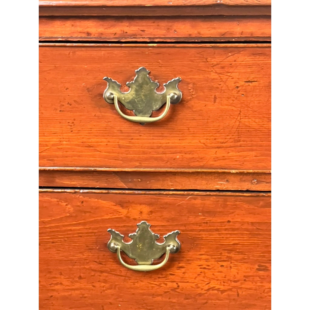 Close-up of two drawers from an Antique Chippendale Pine Graduated Four Drawer Chest, c. Late 18th Century, attr. Northampton MA maker—showing ornate brass handles, orange-brown finish, visible wood grain, and classic vintage wear.
