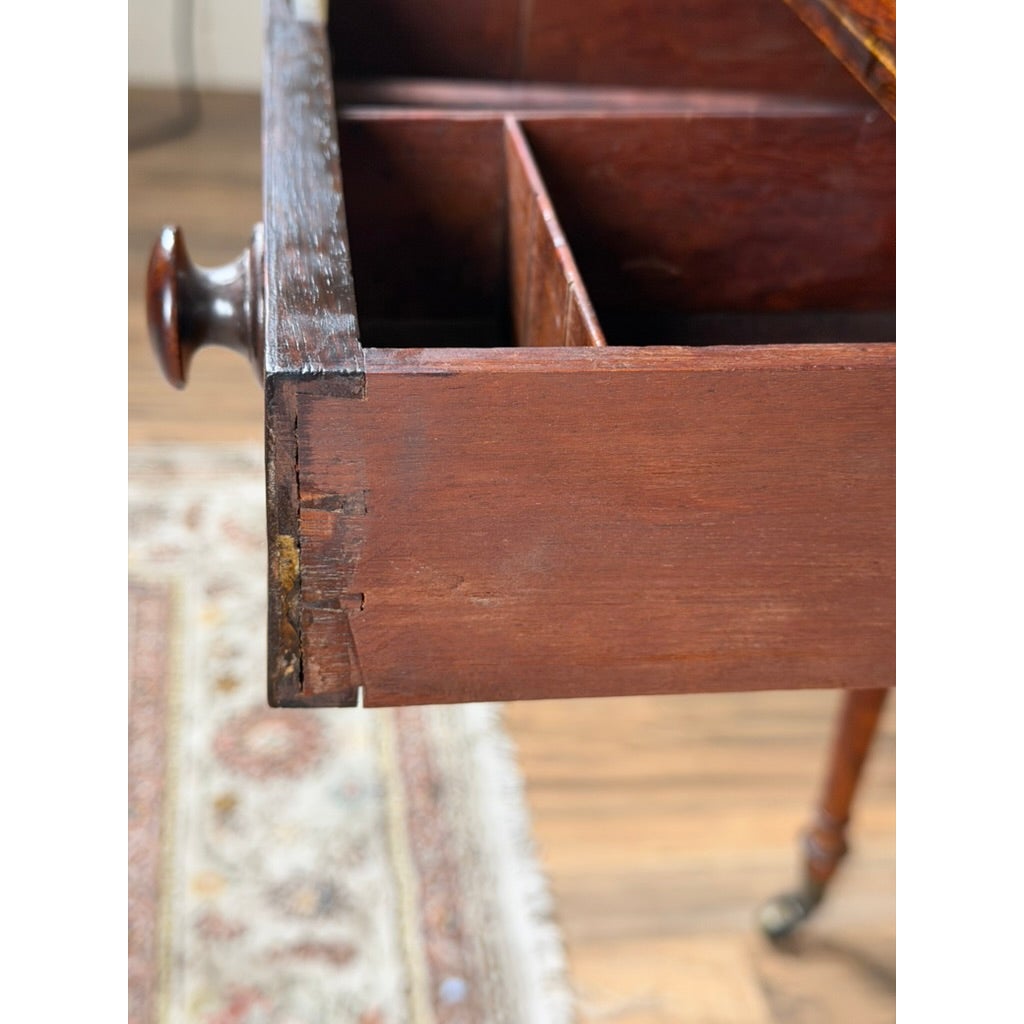Close-up of an open drawer on an English Regency Rosewood Two-Drawer Drop-Leaf Work Table with Brass and Satinwood Inlay, showing the interior divided into compartments.