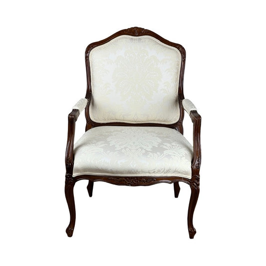 A Vintage Louis XV Style Fauteuil Arm Chair by Pennsylvania House, featuring a carved dark wood frame and cream damask upholstery, is shown from the front against a white background.