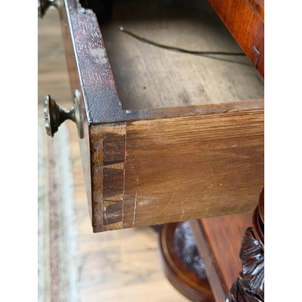 Close-up of a hand-cut dovetail drawer and brass knob on an American Classical Carved Mahogany Dressing Table with Original Mirror, Probably New York, c. 1825–1835.