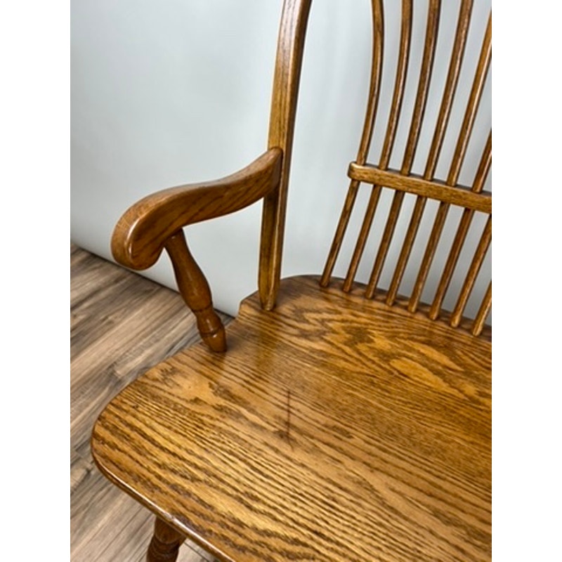 Side view of vintage oak Windsor bench with wide seat