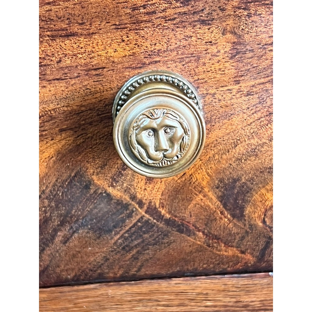 An Antique Federal Mahogany Two Drawer Work Stand (c. 1820) features brass lion’s head pulls and warm brown wood grain, evoking the charm of a classic antique sewing table. Brand: Unknown.