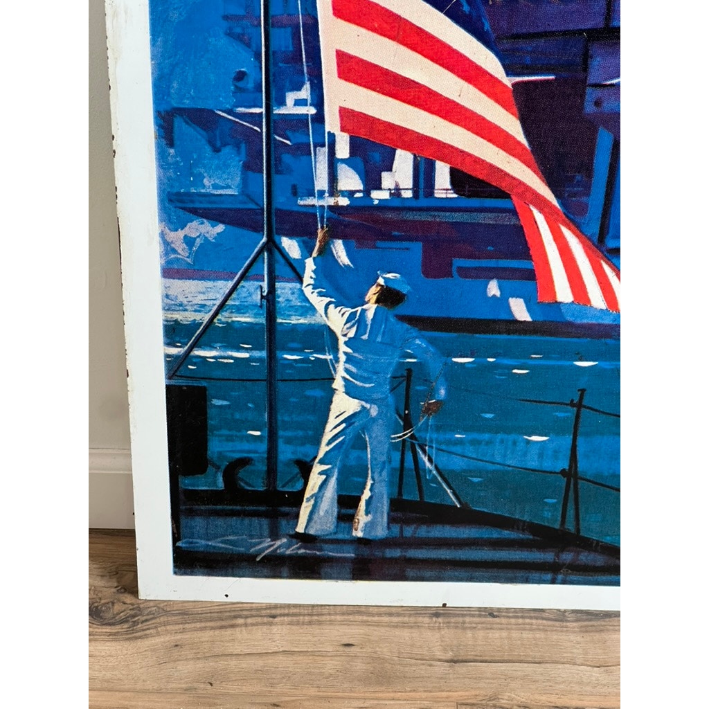A sailor in white raises the American flag aboard the USS Saratoga, set against a vivid blue ocean. This double-sided Vietnam Era U.S. Navy recruiting tin sign features Lou Nolan's iconic style—perfect for military collectibles.