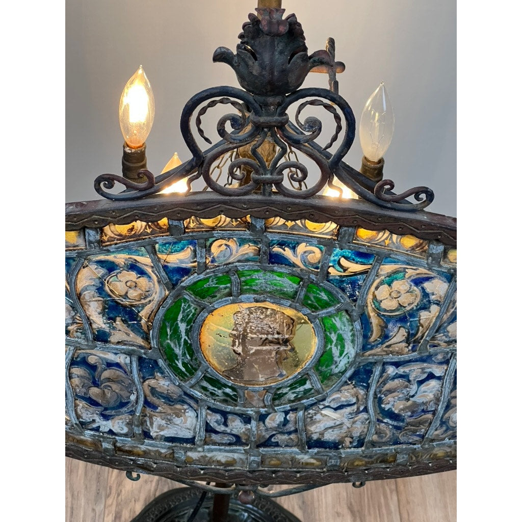 The Antique Five Burner Lucerne Whale Oil Lamp with Napoleon I Fireplace Screen Shade features ornate floral patterns, a decorative metal frame, and five burners, casting a warm glow reminiscent of Napoleonic elegance.