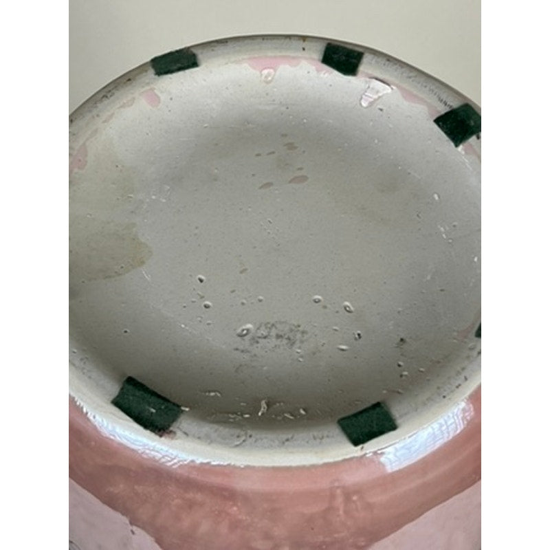 The image shows the bottom of a Vintage Sakura Style Cherry Blossom Tall Vase with an unglazed base, several rectangular dark green felt pads, and a pink exterior visible along the edge for a modern ceramic decor accent.