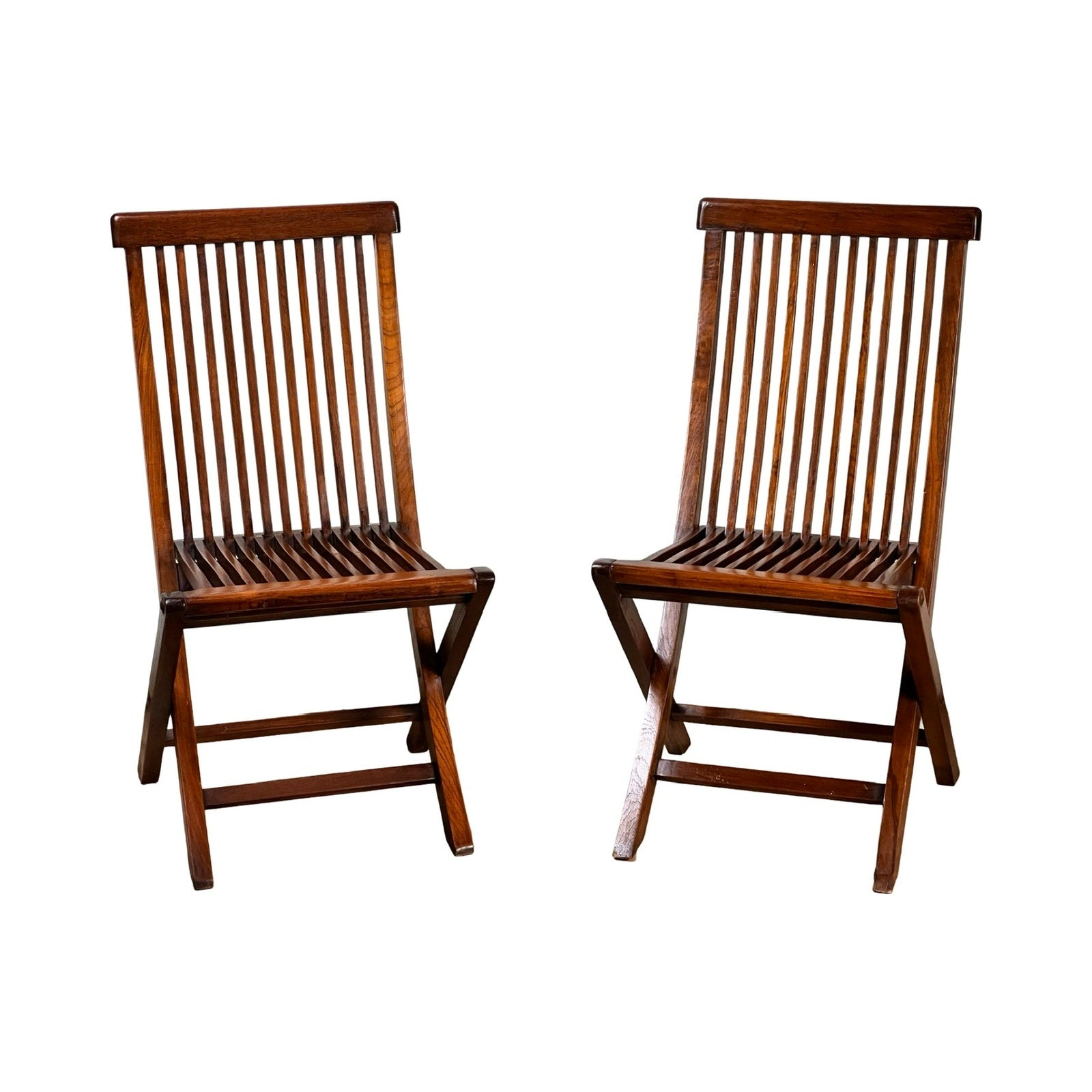 A Pair of Vintage Mid-Century Modern Style Teak Folding Chairs, featuring slatted backs and seats, are positioned side by side against a white background. Brand: None/Unknown.