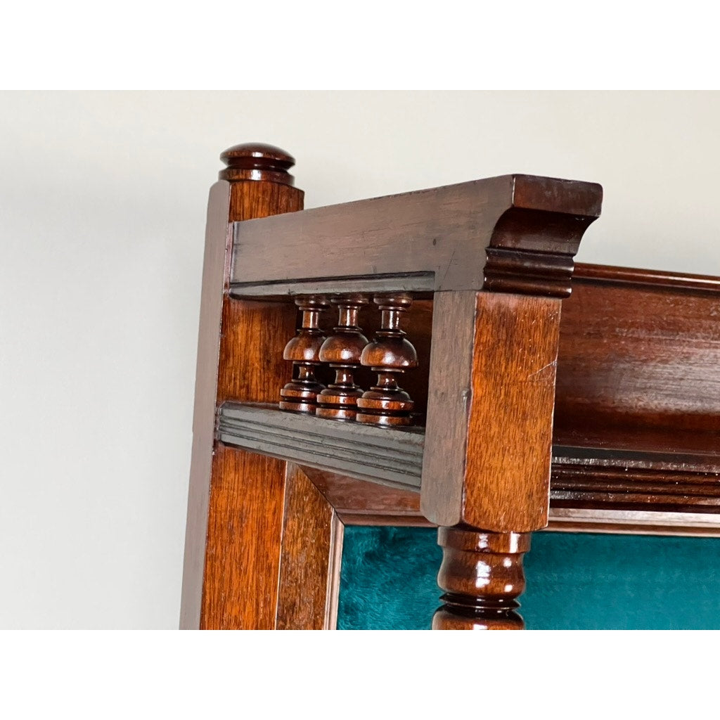 Close-up of an Antique Victorian Aesthetic Movement Mahogany Four Over Four Gentlemen’s Chest c. 1880, highlighting polished woodwork, decorative turned spindles, green upholstered panel, and intricate details typical of the period.