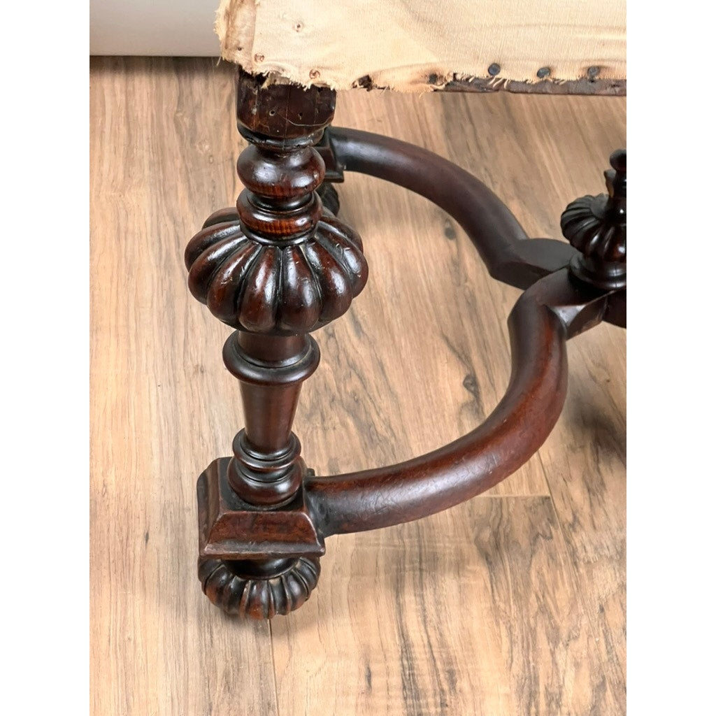 The Antique Fine Carved Flemish Side Chair, attributed to Daniel Marot c. late 17th century, features ornately carved legs with floral motifs, curved crossbars, exposed tacks on the seat, fraying fabric, and stands on light wood flooring.