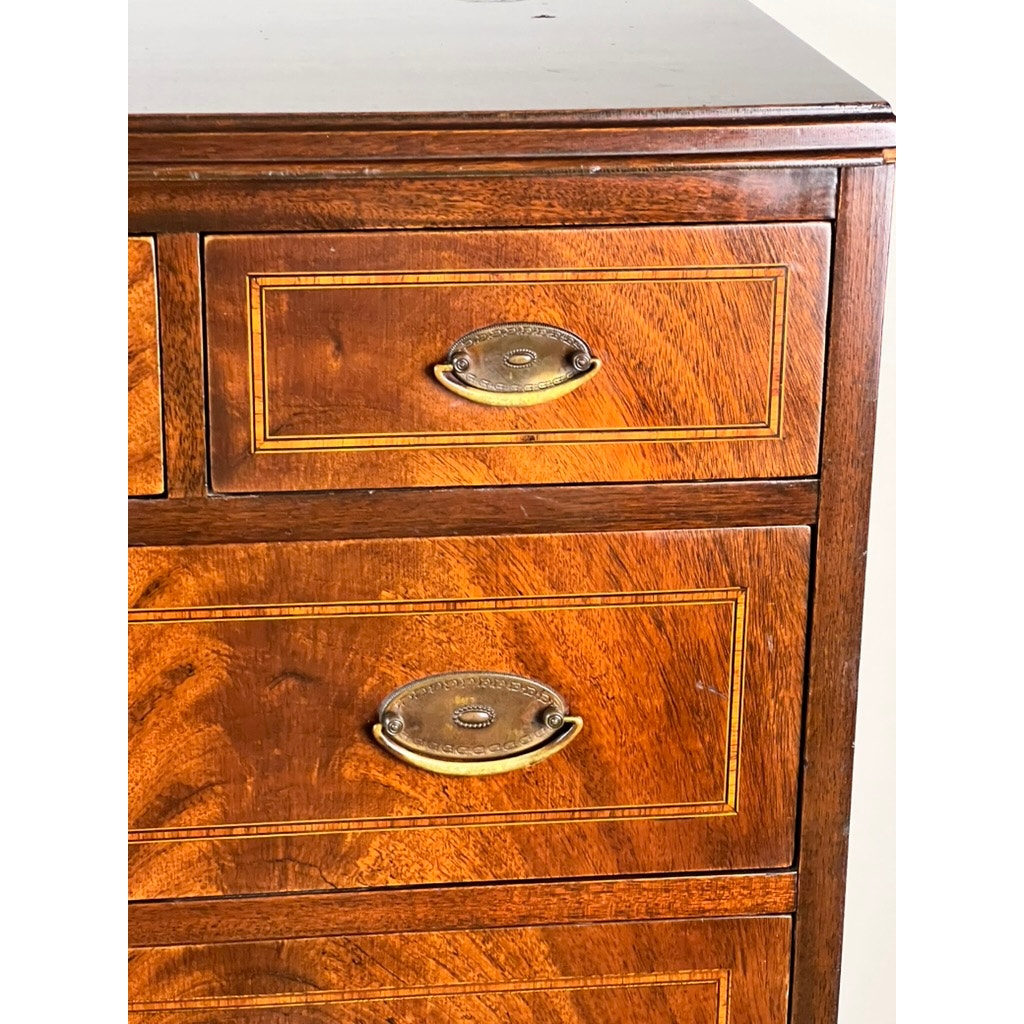 Close-up of three drawers with brass handles and decorative inlay, highlighting the rich flame mahogany grain and fine craftsmanship distinctive of a Vintage Dutch Woodcraft Shops Federal Style Chest on Stand (c. 1945–1955). Only the top right portion of the piece is visible.